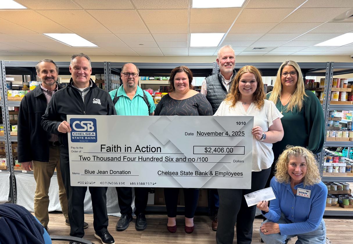 Caption: Chelsea State Bank’s Mark Stevens, John Lee, Joe Stempek, Emily Schaible, Bill Bacon, Madison Welshans, and Nicole Bell pictured with Robin from Faith in Action – Dexter