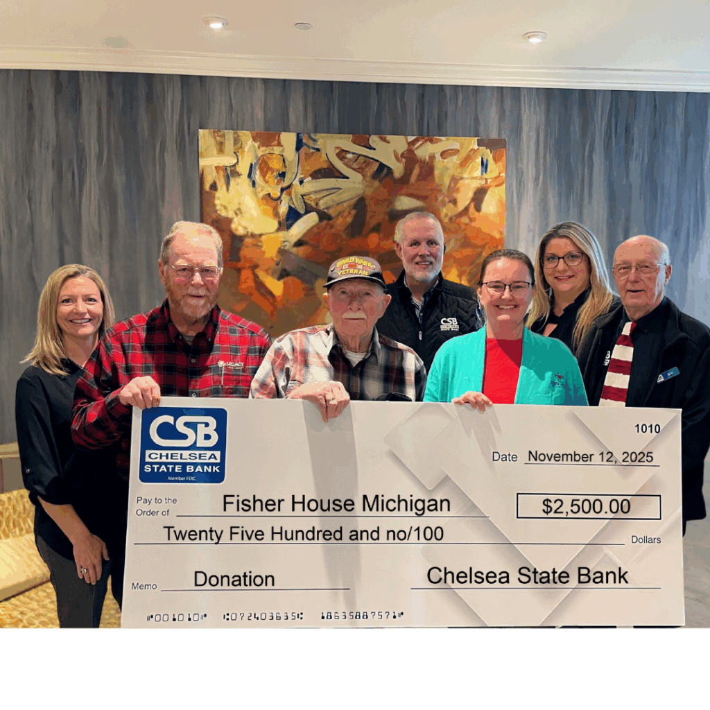 Chelsea State Bank's Joanne Rau, Bill Bacon, Bill Ballagh and Nicole Bell pose for a picture with Fisher House of Michigan's Kate Melcher, along with Don Doll and Larry Doll
