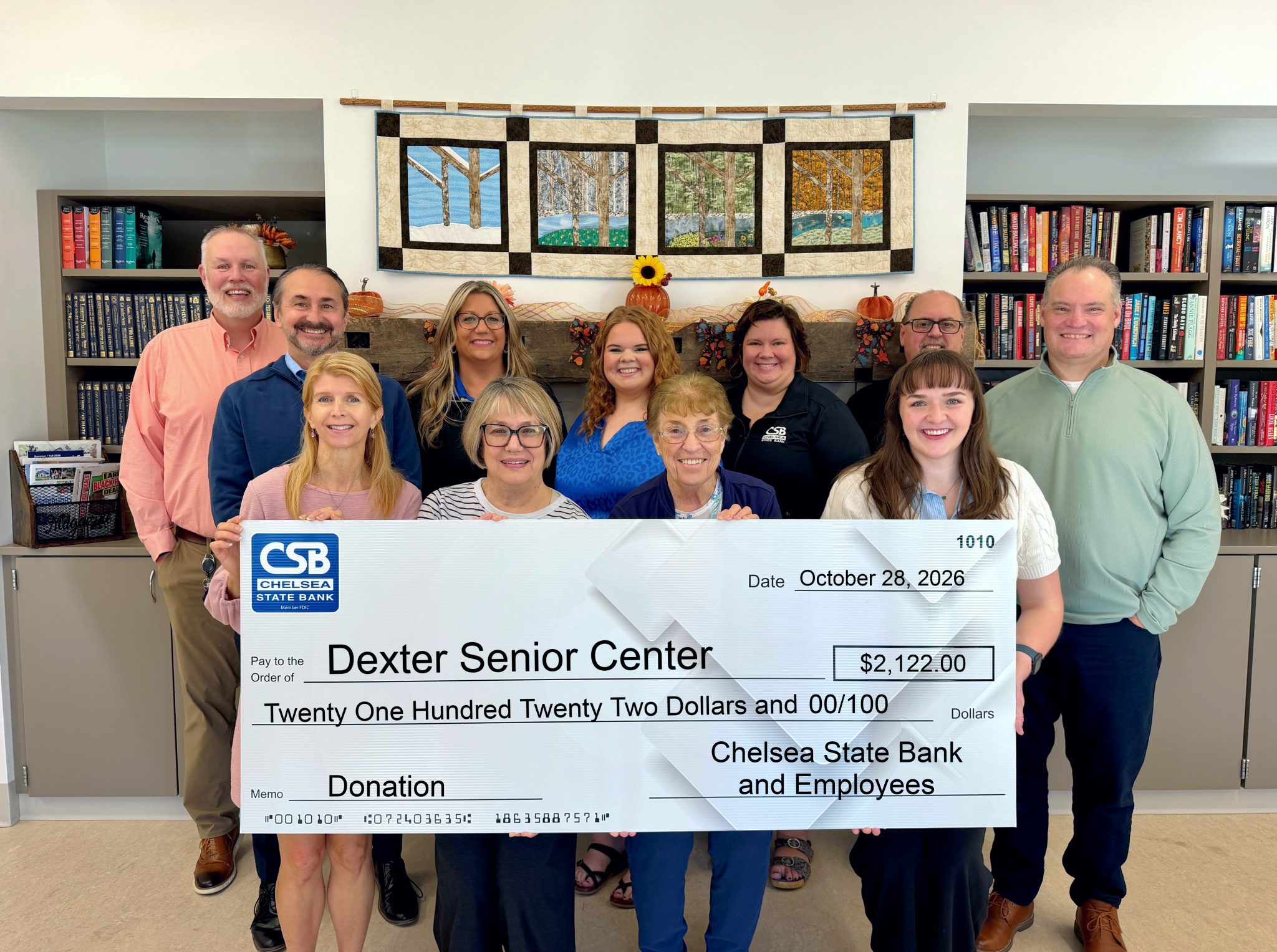 Chelsea State Bank and its employees collectively donate $2,122 to Dexter Senior Center through their Blue Jeans for Charity Donation Program